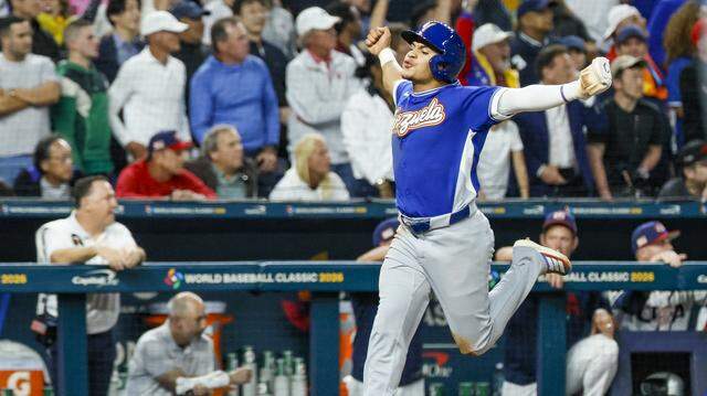 Venezuela outfielder Javier Sanoja (4) celebrates as he runs to homeplate to score on a double by Eugenio Suárez (7) in the ninth inning during the final game of the 2026 World Baseball Classic at loanDepot park on Tuesday, March 17, 2026.